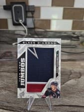 2024-25 Upper Deck Black Diamond Team Logo Jumbo Patch Puzzle - Blue Jackets Zach Werenski #TL-ZW card