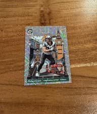 Christian McCaffrey 2023 Panini Donruss Optic International Downtown card