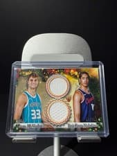 2025-26 Topps Holiday Dual Player Relics Liam McNeeley / Yanic Konan Niederhäuser #DPR-LM card