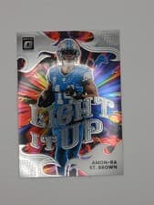 2025 Donruss Optic Light it Up Amon-Ra St. Brown #15 card