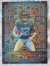 2025 Panini Mosaic Stained Glass Travis Hunter #12