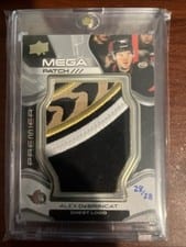 2022-23 Upper Deck Premier Premier Mega Patch Chest Logos Alex DeBrincat #PMP-AD card