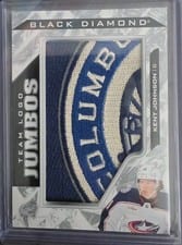 2024-25 Upper Deck Black Diamond Team Logo Jumbo Patch Puzzle - Blue Jackets Kent Johnson #TL-KJ card