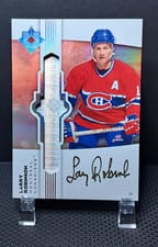 2022-23 Upper Deck Ultimate Collection Ultimate Emblems Autograph Larry Robinson #UE-RO card