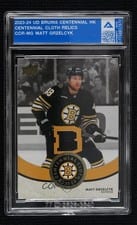 2023-24 Upper Deck Boston Bruins Centennial Centennial Cloth Relics Matt Grzelcyk #CCR-MG card